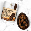 Charger l'image dans la galerie, Œuf surprise au chocolat noir garni de cocos pralinés et caramel salé (100g)